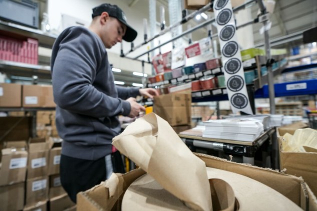 GLS warehouse staff reading a parcel label