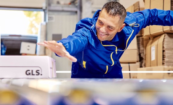 Happy man grabs a package
